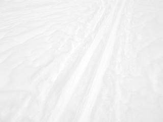Obraz premium Ski track background. Snowy surface, texture of snow. Leisure activity and sport in the winter.