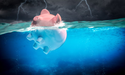 piggybank floats in the stormy sea