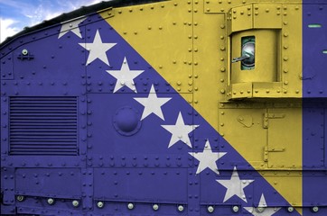 Bosnia and Herzegovina flag depicted on side part of military armored tank closeup. Army forces...