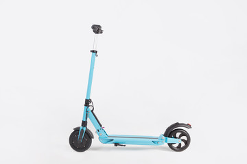 Blue electric kick scooter with seat on white background, side view