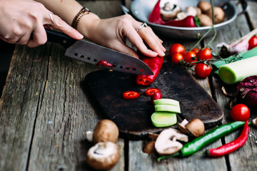 woman cutting vegetables in the kitchen