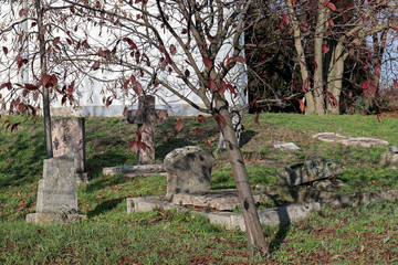 Tombstones in the old cemetery near a chapel