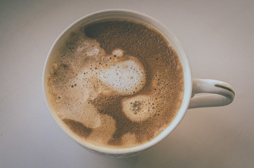 Hot cup of coffee with almond milk