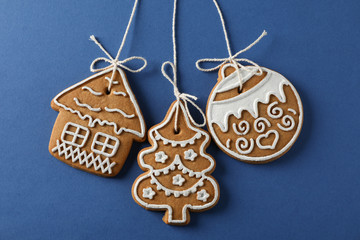 Homemade Christmas cookies on blue background, space for text. Closeup