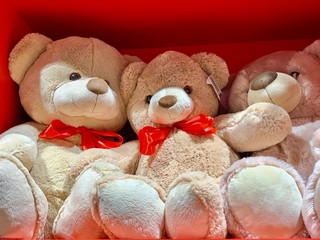 Soft toys on a store shelf. New Year's dolls for children in a supermarket. Cartoon characters, polar bear toy.