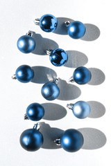 Christmas decorations balls trendy green and blue flat lay