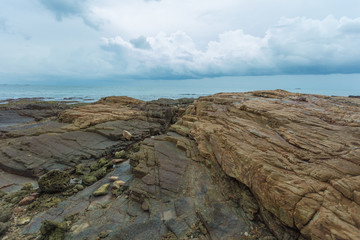 Stones and rocks on the coastline of the ocean after an outflow