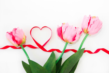 natural pink tulips and red ribbon heart