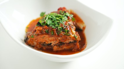 Eggplant with ground beef in tomato sauce in the oven