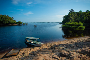 A boat from traditional communities on the Negro River in Anavilhanas National Park. Amazonas, Brazil