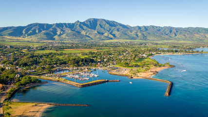 Stunning aerial shot of Hawaiian town and mountain behind