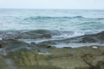Sea waves ashore close up