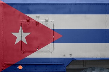 Cuba flag depicted on side part of military armored truck closeup. Army forces conceptual background