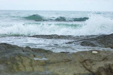 Sea waves ashore close up