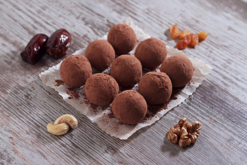 Natural helpful candy from dates, nuts, honey and raisins. Healthy food. Eastern sweets.