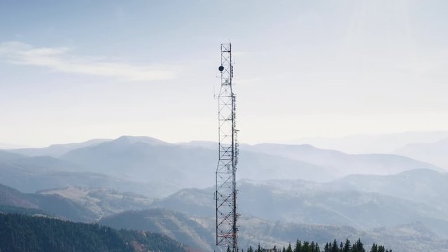 Communication transmitter tower on a hill top in the Parang Mountains