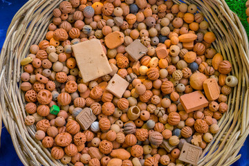 Ceramic beads with leather ropes in basket. from chiangmai Thailand.