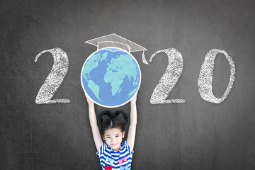 2020 new educational academic calendar year for school class with student kid raising world global planet on teacher's black chalkboard for back to school celebration, classroom schedule