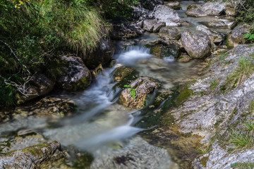 Tiny waterfalls at the Val Vertova torrent Lombardy near Bergamo in Italy