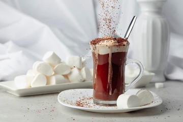 Hot chocolate with marshmallows sprinkled with chocolate crumbs.