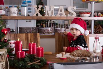 Happy children, boy brothers, baking christmas cookies at home