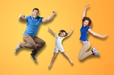 Full length body size portrait of nice lovely adorable attractive positive cheerful people dad daddy mom mommy spending spare free time isolated over shine vivid pastel yellow background