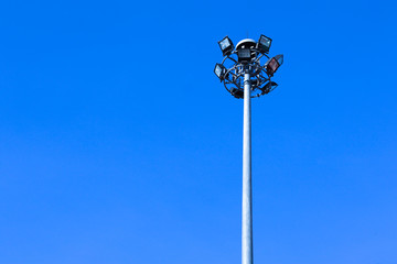 Spotlight pole with space on blue sky background