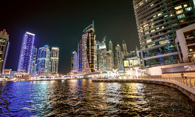 Dubai Marina night skyline. Buildings and river, United Arab Emirates