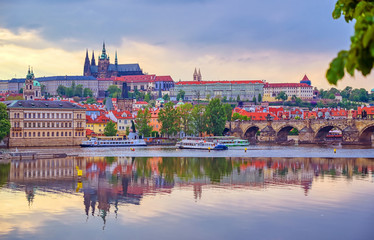 Fototapeta premium A view of Prague Castle and the Charles Bridge across the Vltava River in Prague, Czech Republic.