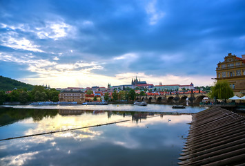 A view of Prague Castle and the Charles Bridge across the Vltava River in Prague, Czech Republic.