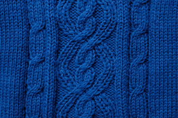 Blue knitted texture background. Trendy color 2020 concept. Copy space for text and design.