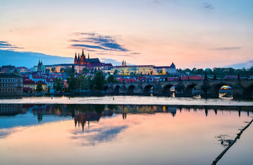 Naklejka premium A view of Prague Castle and the Charles Bridge across the Vltava River in Prague, Czech Republic.
