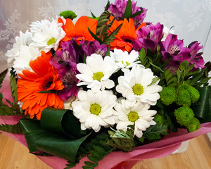 different beautiful flowers in a vase. bouquet of different flowers