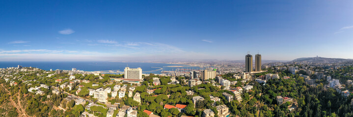Aerial image of Haifa, Israel, showing houses on central Carmel area with Haifa bay in the...