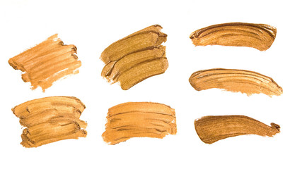 Set of golden color smudges, splashes and strokes.