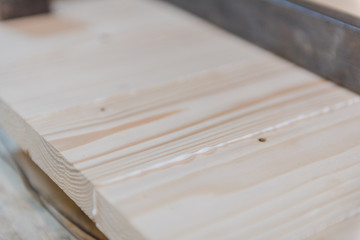 gluing a wooden board. shield from the boards. boards attracted by clamps.