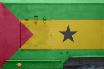 Sao Tome and Principe flag depicted on side part of military armored truck closeup. Army forces...