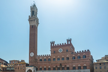 Fototapeta na wymiar Campo square and the Campanile, Torre del Mangia in Siena