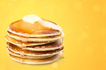 Fresh roast pancakes with oil on abstract bokeh background