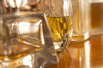 glares and lights through perfume bottles