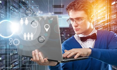 young it engeneer business man with thin modern aluminium laptop in network server room