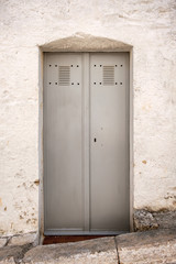 Obraz na płótnie Canvas Power distribution wiring switchboard panel outdoor unit, closed metal door.