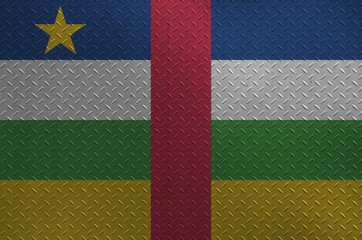Central African Republic flag depicted in paint colors on old brushed metal plate or wall closeup....