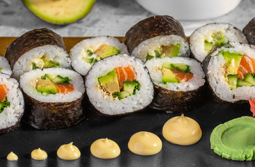 Sushi set with maki roll, fresh salmon and tuna nigiri