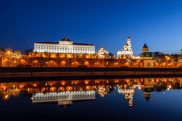 Panorama of the Moscow Kremlin in the early morning with a mirror reflection in the Moscow river, Russia