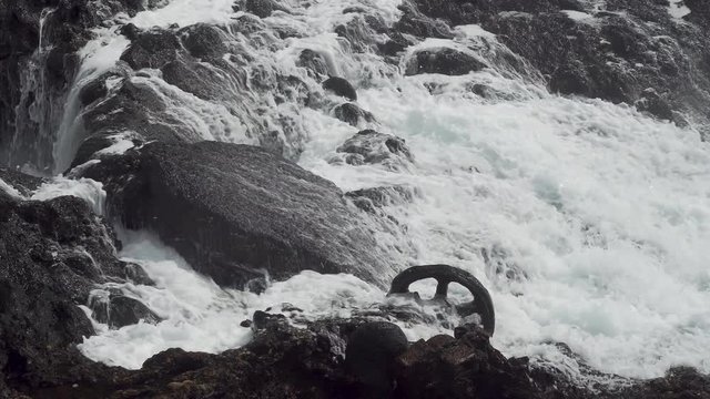 Calcified Metal Wheel Rusting on Ocean Shore Close Up