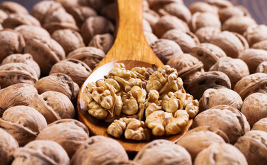 Still life with nuts on natural wood.