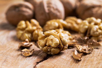 Still life with nuts on natural wood.