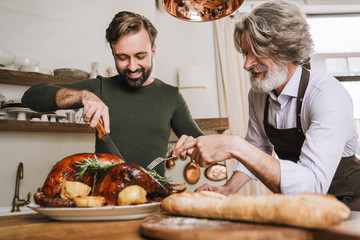 Happy father and his adult son celebrating Christmas