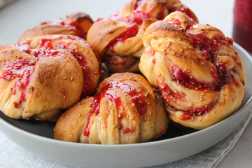 Yeast buns with raspberry jam